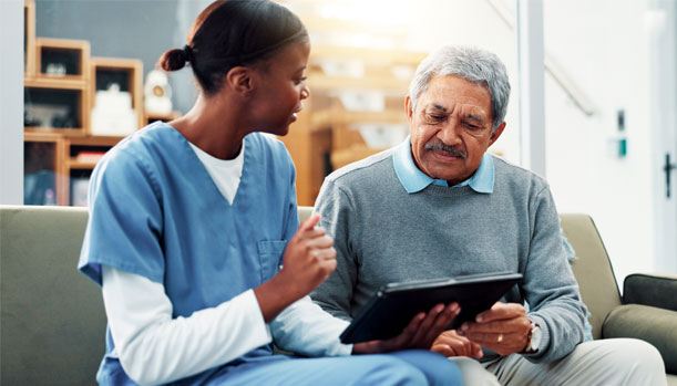 Therapy nurse consulting a mature patient